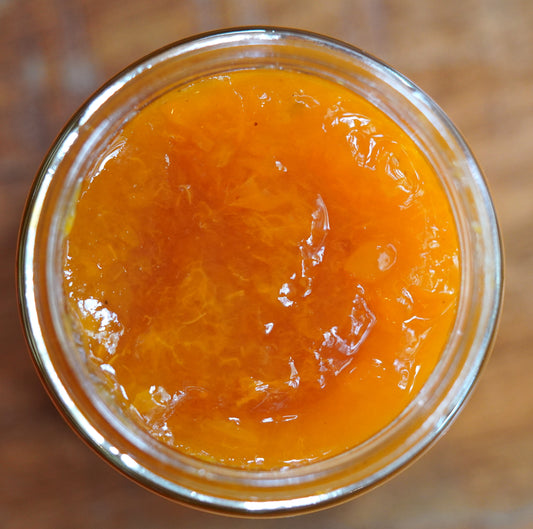 Jar of Apricot Brandy, which is thick and slightly chunky  and very bright orange