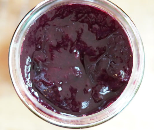 Open jar with blackberry bramble which is smooth with no seeds