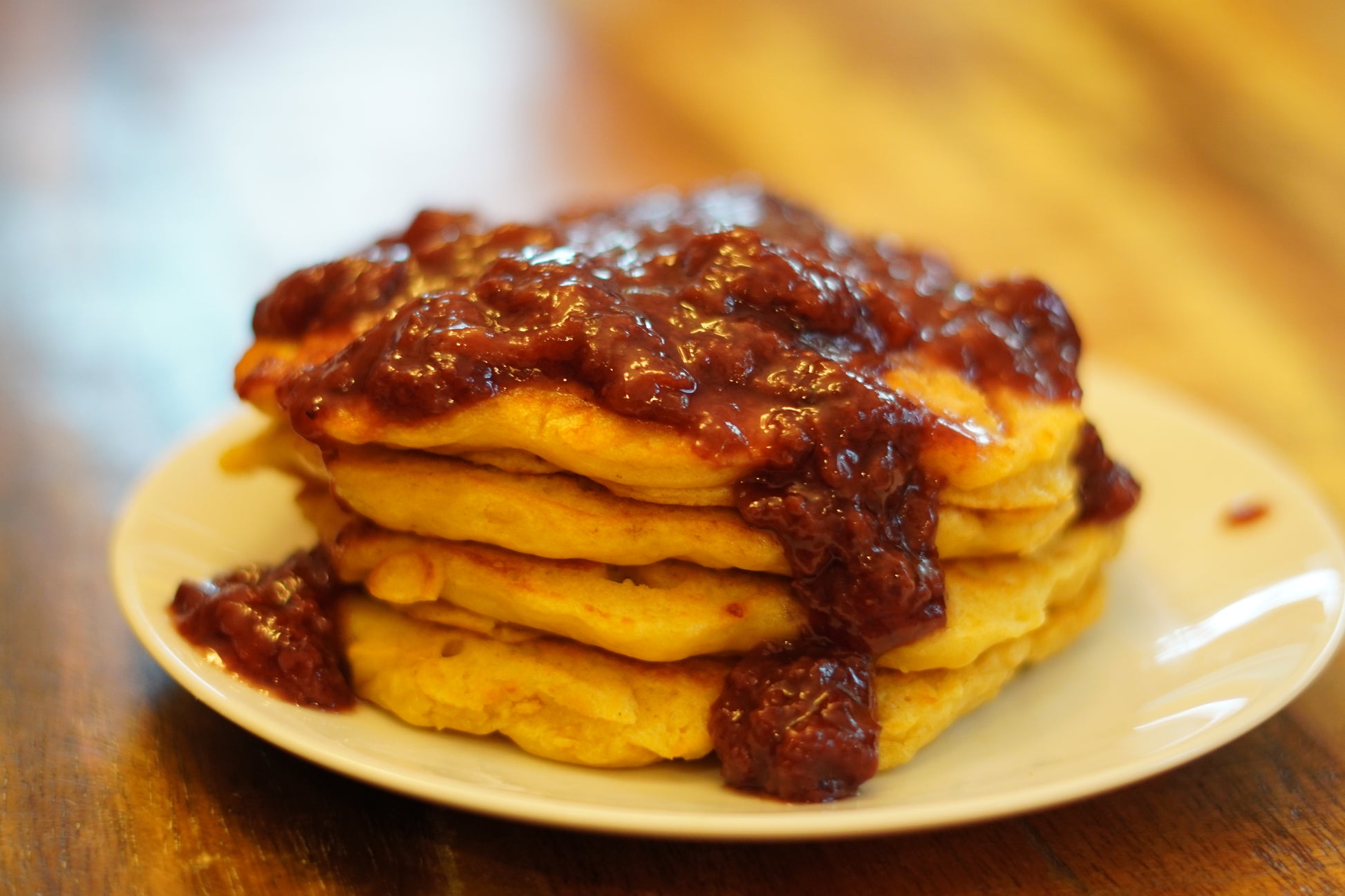 Stack of 4 pancakes with a generous amount of Strawberry Daiquiri Fruit Spread on top